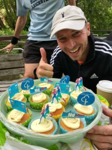 George giving thumbs up with celebratory cakes