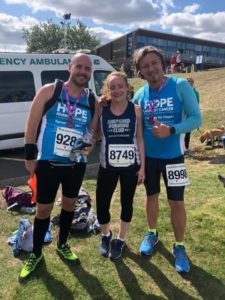 3 runners with medals