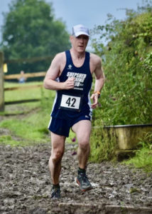 Runner going through mud